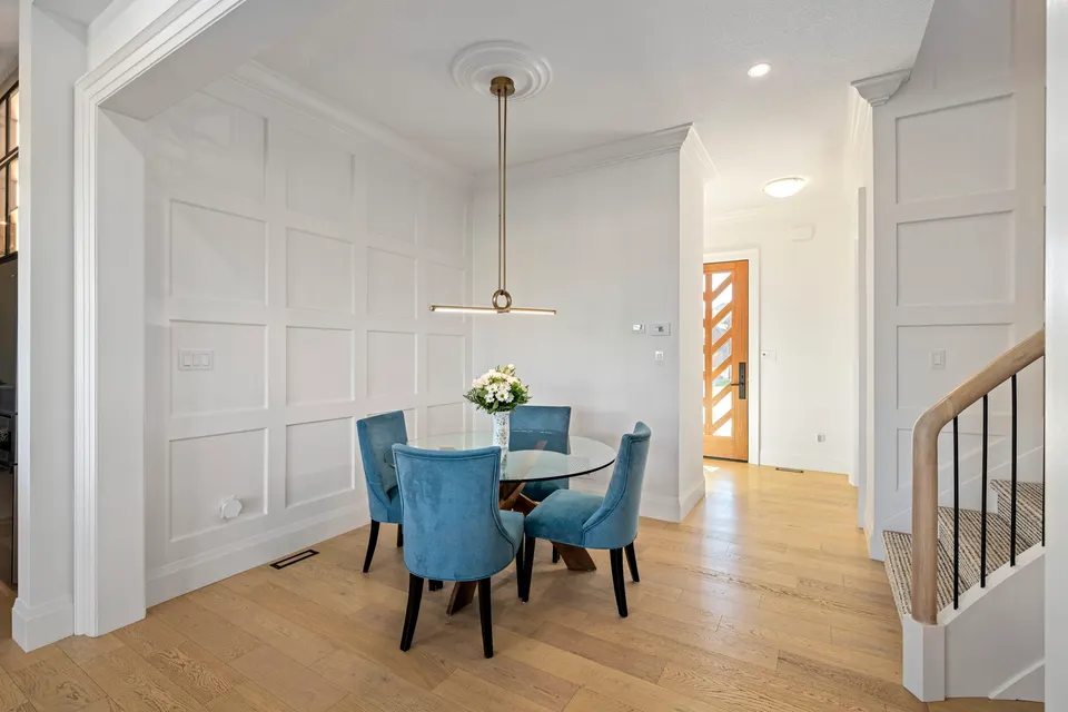 Formal dining room with wall mouldings, ceiling medallion and white oak floors