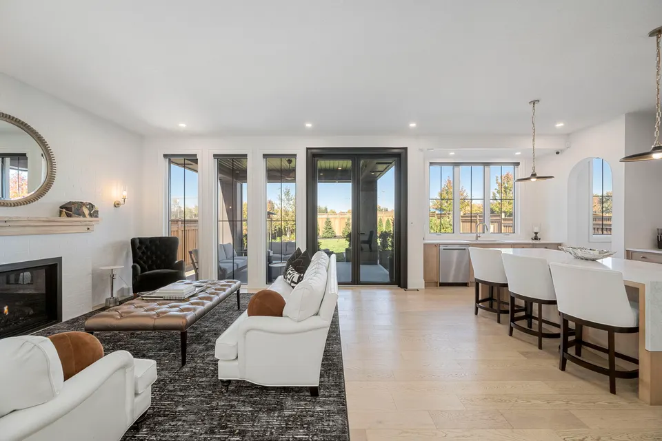 Great room with the gas fireplace and the nine-foot French doors to the porch