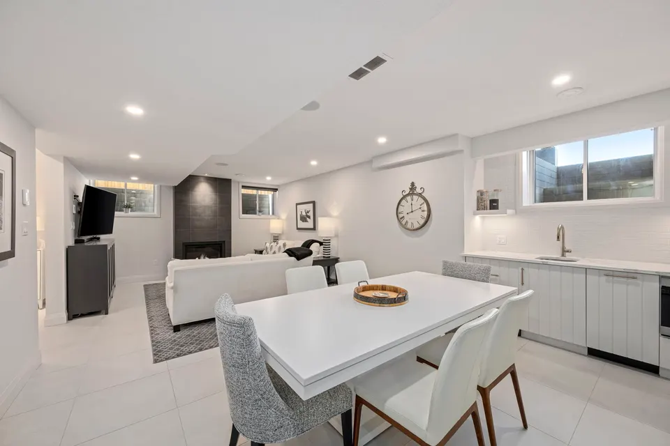 Lower level kitchen and dining area open to the recreation room